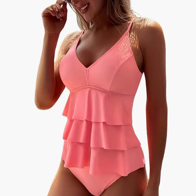 Einteiliger Damen-Badeanzug mit V-Ausschnitt und mehrlagigen Rüschen.
