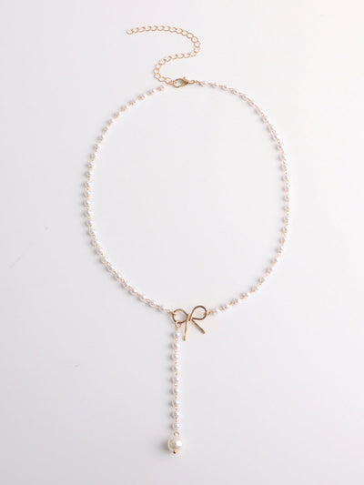Elegante Halskette mit Perlen und Schleifen